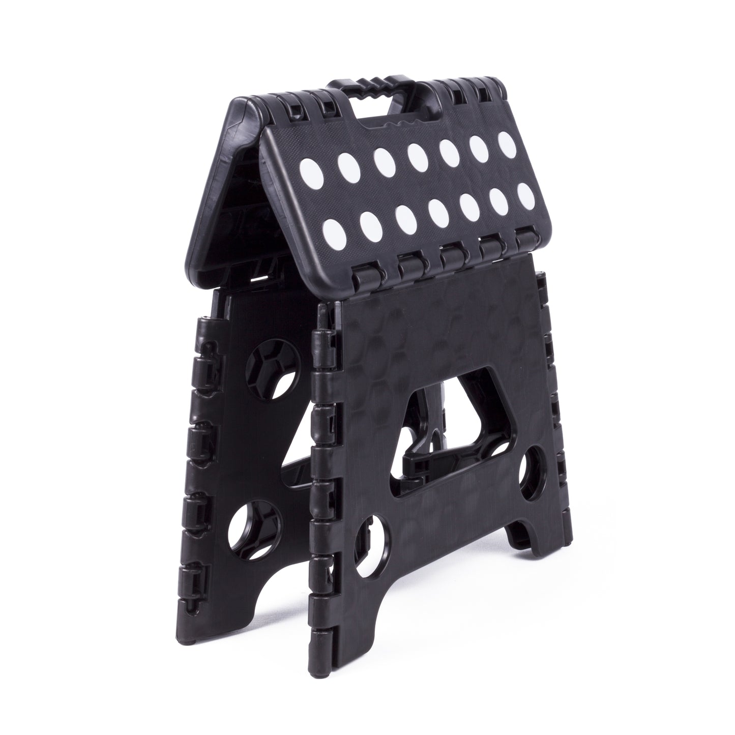 Zusammengeklappter schwarzer Klapphocker mit weiß gepunkteter Sitzfläche und Grifföffnung an der Oberseite zum einfachen Tragen.