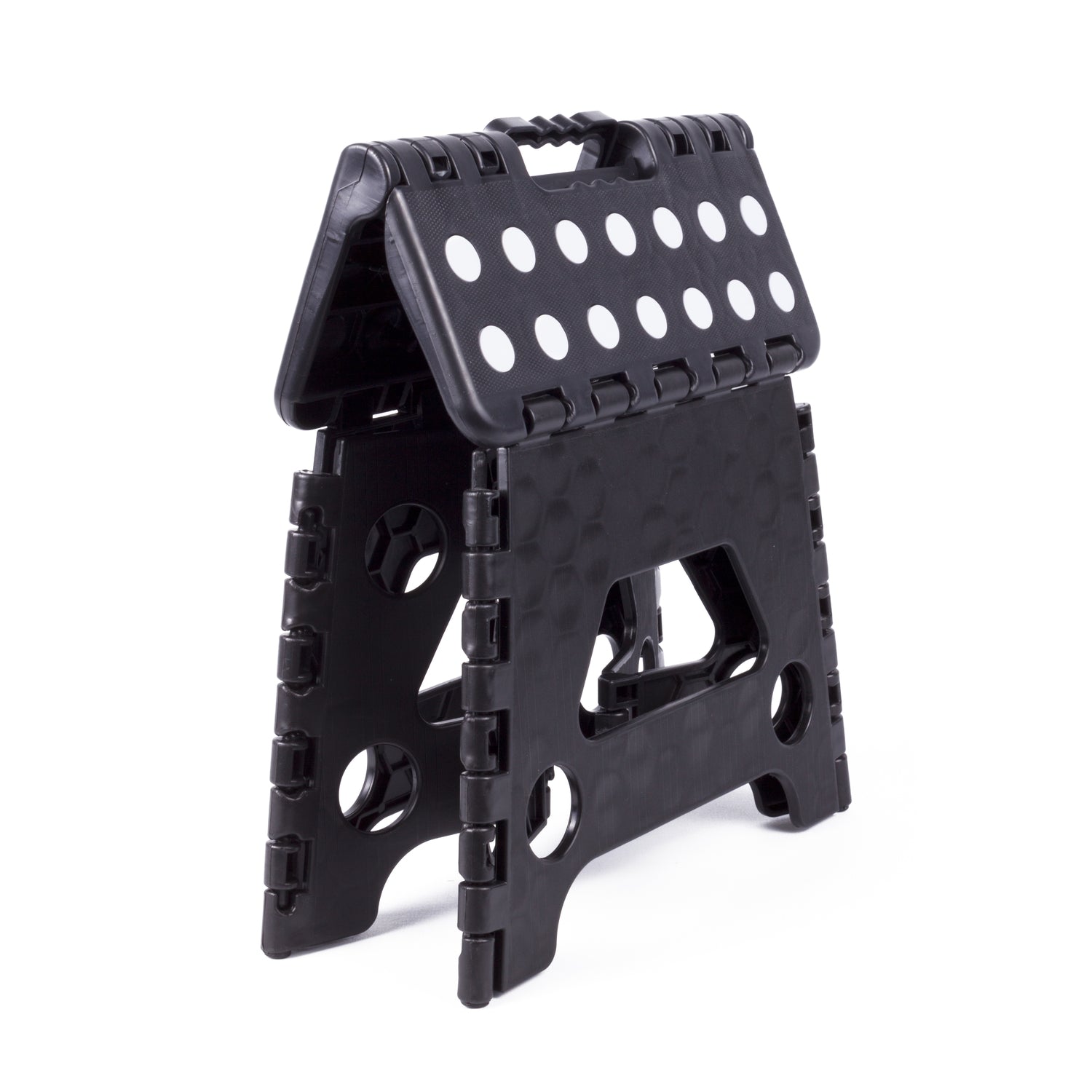 Zusammengeklappter schwarzer Klapphocker mit weiß gepunkteter Sitzfläche und Grifföffnung an der Oberseite zum einfachen Tragen.