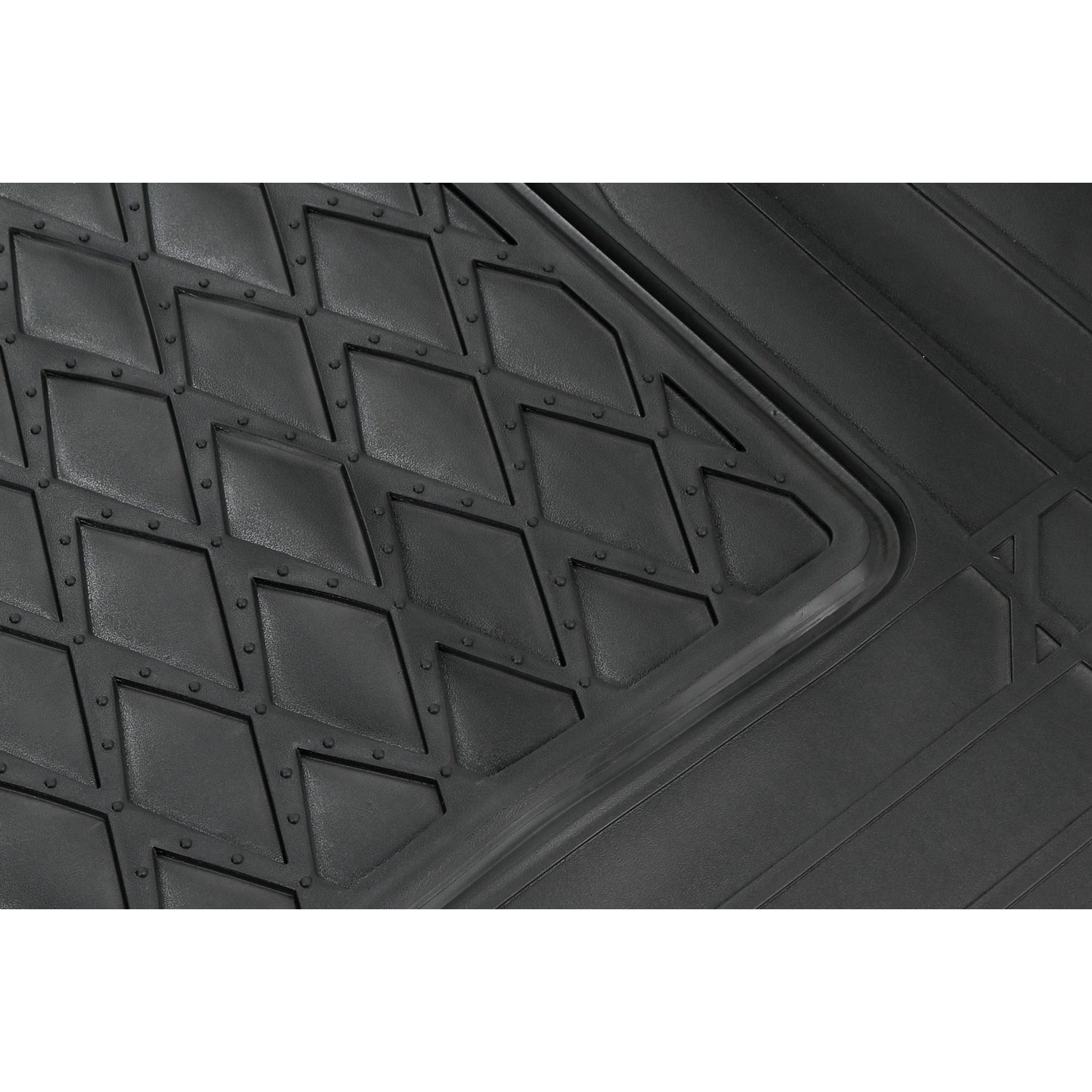 Detailaufnahme der Kofferraummatte mit Nahansicht der erhabenen, rautenförmigen Struktur und umlaufender Kante.