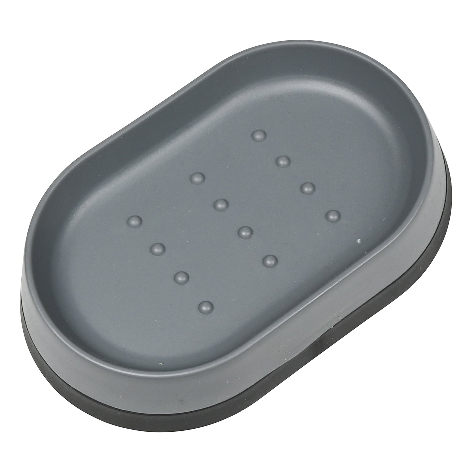 Graue, ovale Seifenschale mit erhöhtem Rand und kleinen Noppen im Boden zur Ablage von Seifenstücken.