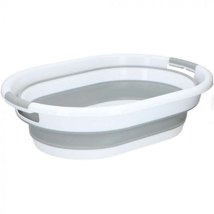 Teilweise eingeklappter ovaler Wäschekorb in Grau und Weiß mit breitem Rand und seitlichen Grifföffnungen.