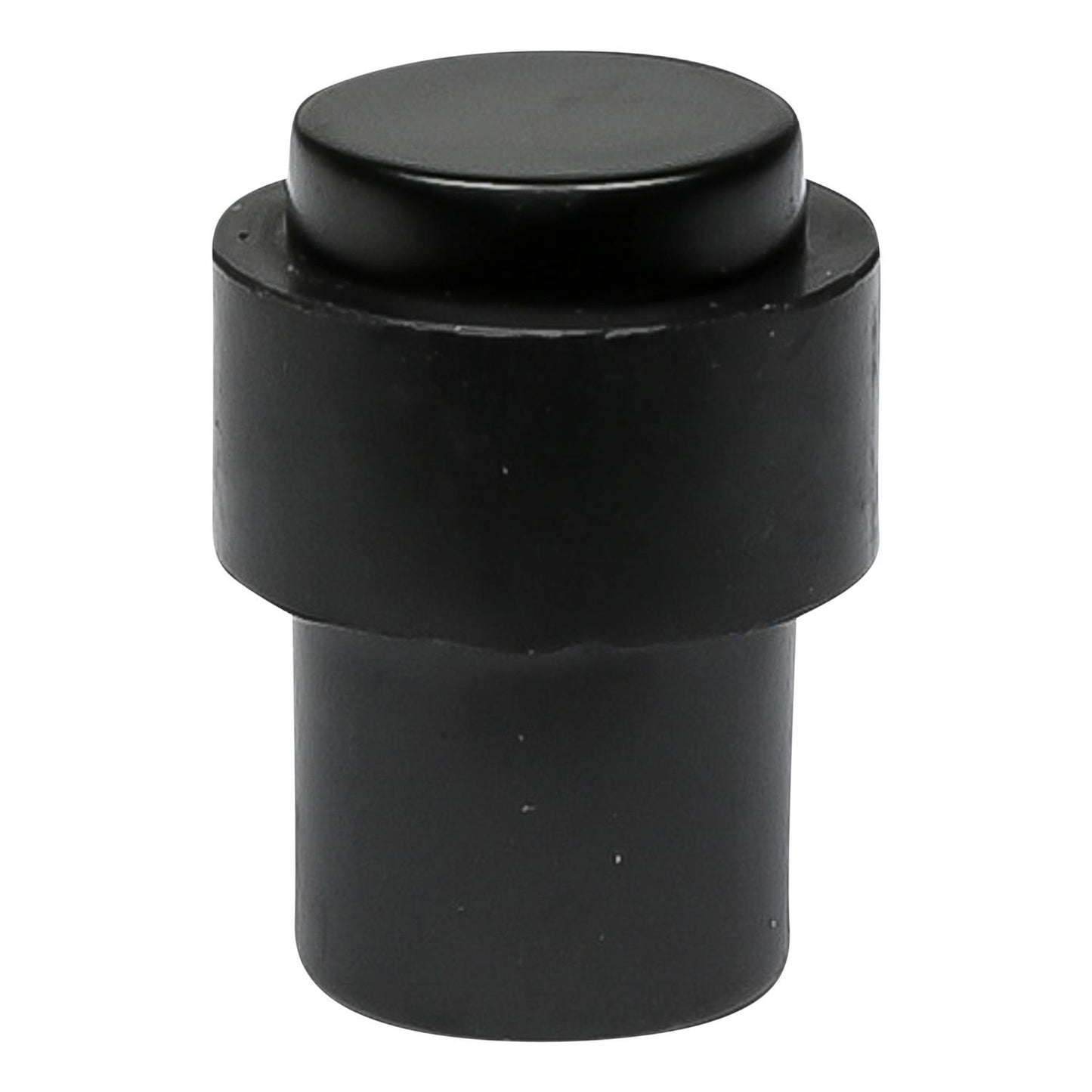 Schwarzer Türstopper in zylindrischer Form mit flacher Oberseite, freistehend auf weißem Hintergrund gezeigt.