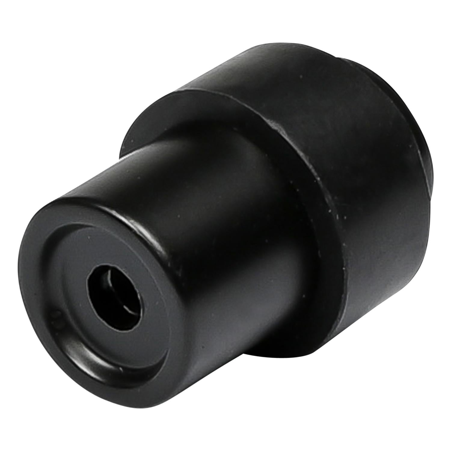 Schwarzer Türstopper in schräger Nahaufnahme, mit sichtbarer Bohröffnung an der Unterseite, auf weißem Hintergrund.