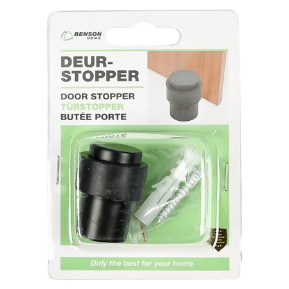Verpackung eines schwarzen Türstoppers mit Schraube und Dübel. Vorderseite mit Produktbezeichnung in mehreren Sprachen und Foto des montierten Türstoppers.