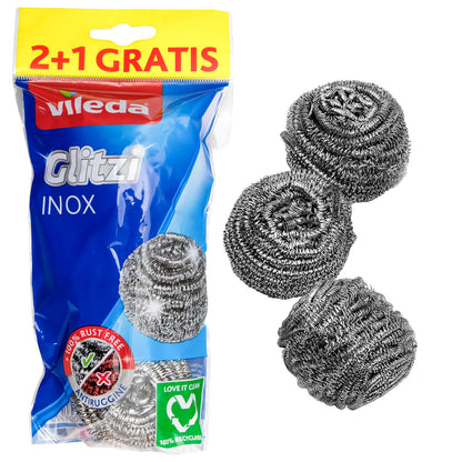 Verpackung mit drei spiralförmigen Topfreinigern aus Edelstahl, sichtbar neben der Verpackung mit Aufschrift „Glitzi INOX“ und „2+1 gratis“.