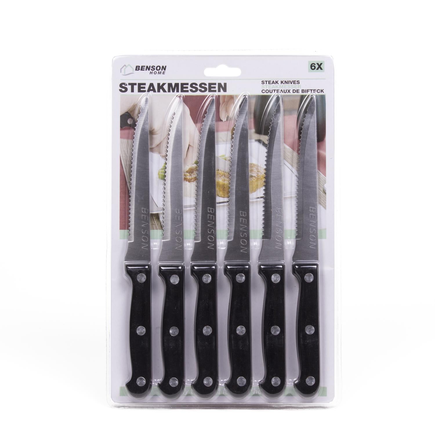 Sechsteiliges Messerset in transparenter Blisterverpackung, Messer mit gezahnter Schneide und schwarzem Griff, Aufdruck „STEAKMESSEN“.